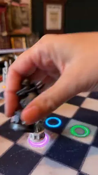 The board lighting up squares to coach the next move